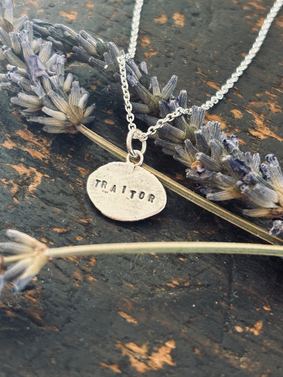 Faithful/traitor pendant